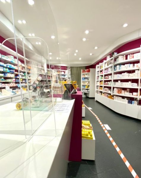 Marbach, Germany - March, 21 - 2020: Pharmacy indoor view with new acrylic glass panels to protect against corona virus. On the right lower side the boundary line can be seen to keep the distance of 1.5 m.